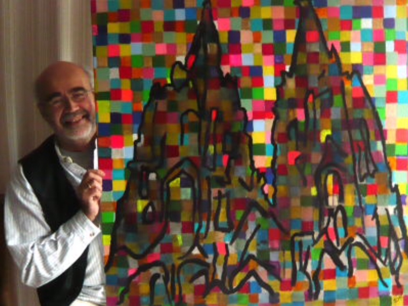 Das Foto zeigt Künstler Rolf Wagner mit dem Gemälde "Kölner Dom mit Richterfenster".